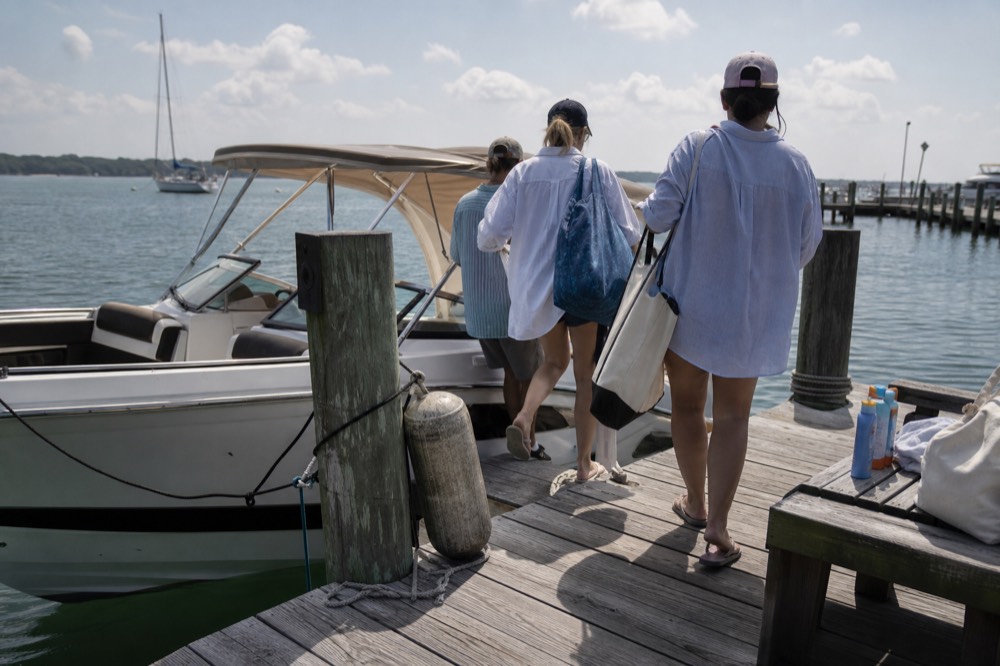 Water taxi passengers boarding at a Fort Lauderdale marina dock on a sunny afternoon, no text, no logos, no people